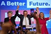 Labor Party leader Anthony Albanese celebrates with his partner, Jodie Haydon, right, and Sen. Penny Wong after winning Australia’s federal elections, Sydney, Australia, May 22, 2022 (AP photo by Rick Rycroft).