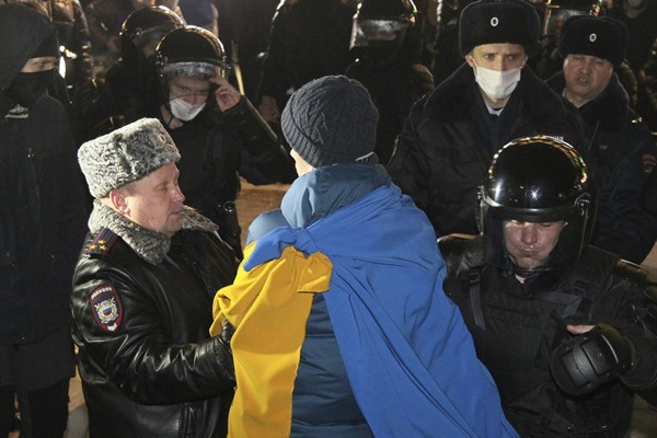 Police officers detain a protester in Nizhny Novgorod, Russia, Feb. 24, 2022 (AP photo by Roman Yarovitsyn).
