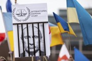 A sign at a rally for Ukraine at the White House shows Russian President Vladimir Putin in prison and calls for him to be prosecuted by the International Criminal Court (NurPhoto by Allison Bailey via AP).