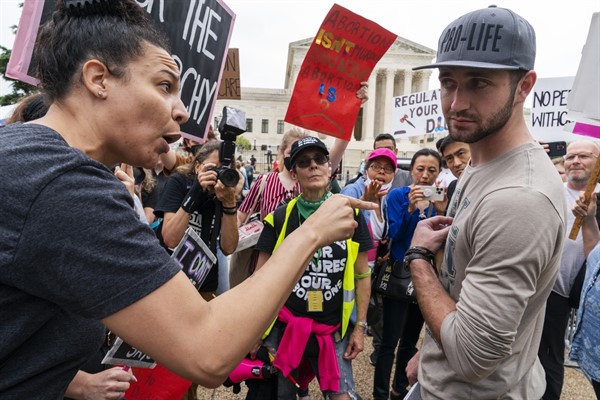 Abortion rights protesters have a heated discussion with a man who is anti-abortion, outside the Supreme Court in Washington, May 14, 2022 (AP photo by Jacquelyn Martin).