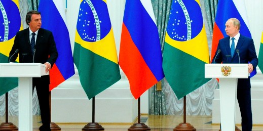 Russian President Vladimir Putin and Brazilian President Jair Bolsonaro attend a joint news conference in Moscow, Russia, Feb. 16, 2022.