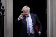 British Prime Minister Boris Johnson waves at the media as he leaves 10 Downing Street to attend the weekly Prime Minister's Questions at the Houses of Parliament, in London, Feb. 9, 2022 (AP photo by Matt Dunham).