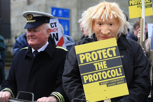 Demonstrators protest outside Hillsborough Castle ahead of a visit by British Prime Minister Boris Johnson, in Hillsborough, Northern Ireland, May 16, 2022 (AP photo by Peter Morrison).