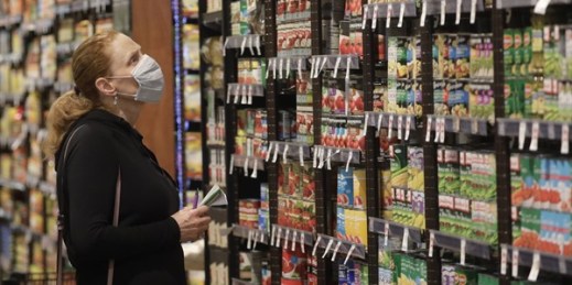 Erin Call wears a mask as she shops for groceries at Harmons grocery store, April 3, 2020, in Salt Lake City (AP photo by Rick Bowmer).