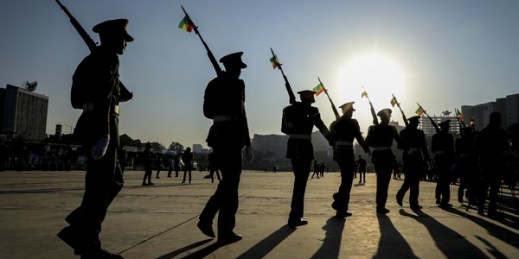 Members of the Ethiopian military parade with national flags attached to their rifles at a rally to show support for the Ethiopian National Defense Force, in Meskel square in downtown Addis Ababa, Ethiopia, Nov. 7, 2021 (AP photo).