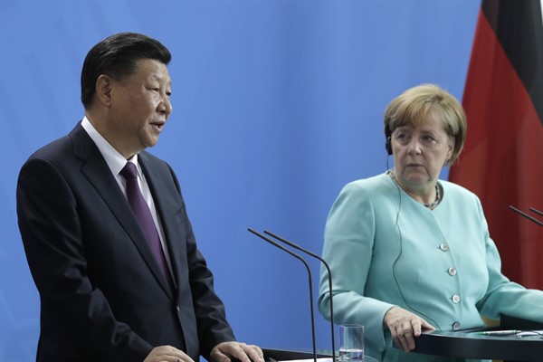 German Chancellor Angela Merkel, right, listens to Chinese President Xi Jinping during press statements at the chancellery in Berlin, Germany, July 5, 2017 (AP photo by Markus Schreiber).