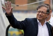 Gustavo Petro, presidential candidate with the Historical Pact coalition, waves upon his arrival to a polling station to vote in presidential elections in Bogota, Colombia, May 29, 2022 (AP photo by Fernando Vergara).