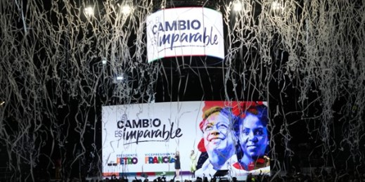 Confetti explode over a screen showing photos of Gustavo Petro and his running mate Francia Marquez after they won Colombia’s presidential election, Bogota, Colombia, June 19, 2022 (AP photo by Fernando Vergara).