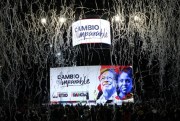 Confetti explode over a screen showing photos of Gustavo Petro and his running mate Francia Marquez after they won Colombia’s presidential election, Bogota, Colombia, June 19, 2022 (AP photo by Fernando Vergara).