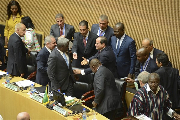 Egyptian President Abdel Fattah el-Sisi is greeted at the opening session of the 33rd AU Summit, where he handed over chairmanship of the bloc to South African President Cyril Ramaphosa, in Addis Ababa, Ethiopia, Feb. 9, 2020 (AP photo).