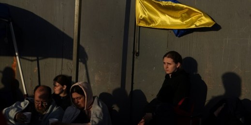 Ukrainian refugees wait near the U.S. border, April 4, 2022, in Tijuana, Mexico (AP photo by Gregory Bull).