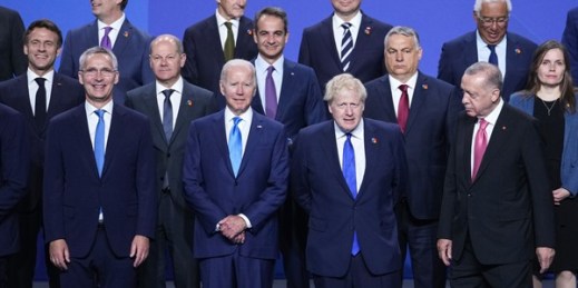 NATO Secretary-General Jens Stoltenberg and U.S. President Joe Biden pose with other leaders for a group photo during the NATO summit in Madrid, Spain, June 29, 2022 (AP photo by Bernat Armangue).