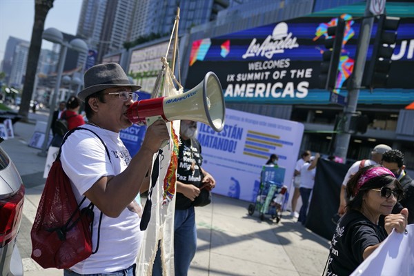 A demonstrator shouts slogans during a protest asking for immigration reform, ahead of the Summit of the Americas, June 7, 2022, in Los Angeles (AP photo by Marcio Jose Sanchez).