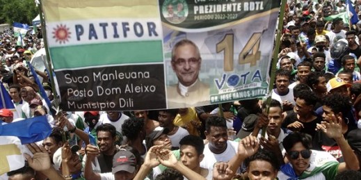 Supporters hold a poster of presidential candidate Jose Ramos Horta during a campaign rally in Dili, East Timor, March 15, 2022 (AP photo by Lorenio Do Rosario Pereira).