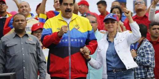 Venezuelan President Nicolas Maduro, center, leads a rally condemning the economic sanctions imposed by the administration of U.S. President Donald Trump on Venezuela, in Caracas, Venezuela, Aug. 10, 2019 (AP photo by Ariana Cubillos).
