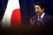 Then-Japanese Prime Minister Shinzo Abe answers a question during a press conference in Tokyo, March 14, 2020 (AP photo by Eugene Hoshiko).