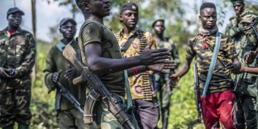 Armed militiamen gather near Rutshuru, 45 miles north of Goma, Democratic Republic of Congo, June 22, 2022 (AP photo by Moses Sawasawa).
