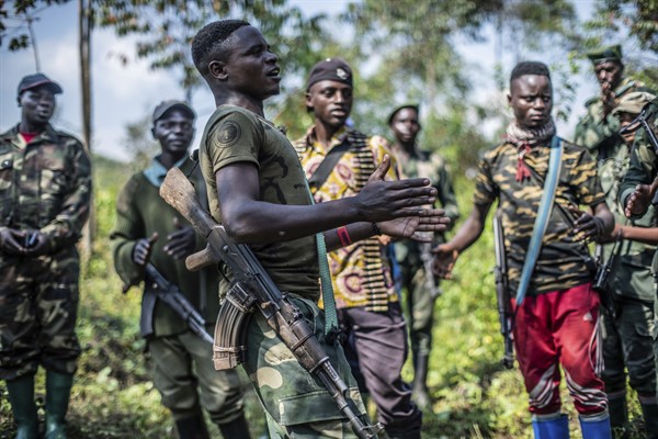 Armed militiamen gather near Rutshuru, 45 miles north of Goma, Democratic Republic of Congo, June 22, 2022 (AP photo by Moses Sawasawa).