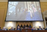 A video is displayed on a screen at a hearing of the House select committee investigating the Jan. 6 attack on the U.S. Capitol, in Washington, June 21, 2022 (AP photo by Jacquelyn Martin).