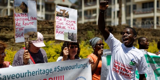 Environmental and wildlife campaigners march to the Chinese embassy to protest the proposed construction of a Chinese-built railway bridge, in Nairobi, Kenya, Oct. 17, 2016.