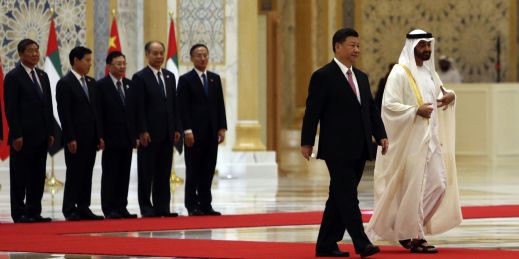Chinese President Xi Jinping walks with then-Crown Prince Sheikh Mohamed bin Zayed Al Nahyan of Abu Dhabi