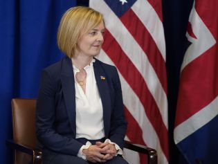 British Prime Minister Liz Truss listens to U.S. President Joe Biden.