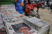 Newspapers in Kenya, formerly part of the British Empire, show coverage of the death of Queen Elizabeth II at a newstand in Nairobi.