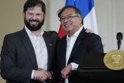 chile's boric shakes hand with fellow pink tide winner gustavo petro of colombia