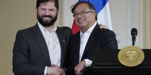 chile's boric shakes hand with fellow pink tide winner gustavo petro of colombia