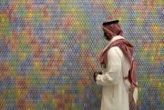 A Saudi man looks at an artwork at King Abdulaziz Center for World Culture.