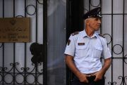 a guard outside iran's embasssy after a cyberattack on albania and nato