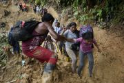 Migrants, mostly Venezuelans, walk across the Darien Gap from Colombia into Panama.