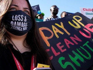 A protestor in support of a "loss and damage" fund for the effects of climate change on the Global South, including Africa