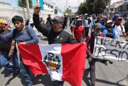 Supporters of ousted Peruvian President Pedro Castillo protest his detention.