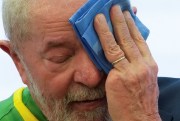 Brazil's president wipes his face as he is inaugurated amid a political and economic crisis across Latin America