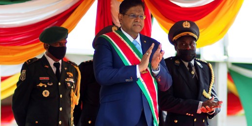 President Santokhi of Suriname faces an economic and political crisis caused by inflation and IMF-backed austerity measures.