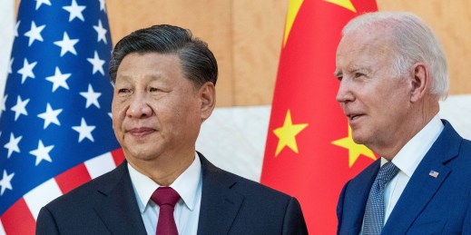U.S. President Joe Biden stands with Chinese President Xi Jinping.