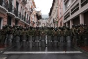 Security forces block protesters from marching to the presidential palace in Quito, Ecuador.