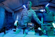 A U.S. marine displays a solar-powered drone.