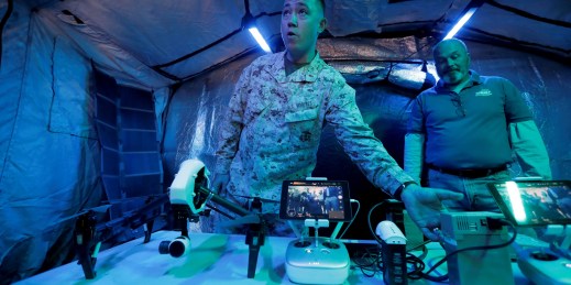 A U.S. marine displays a solar-powered drone.