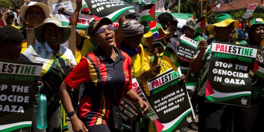 Demonstrators protest against the war in Gaza at the entrance to the Israeli Embassy in Pretoria, South Africa.