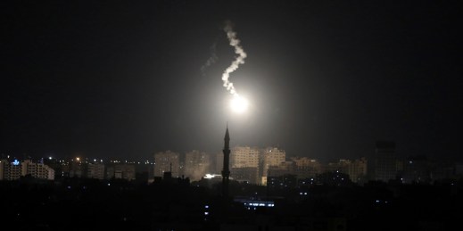 A plume of smoke rises in the sky during an Israeli airstrike on Gaza City