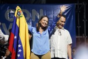 Maria Corina Machado holds the Venezuelan flag