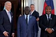 U.S. President Joe Biden poses for photos with Pacific Island leaders.