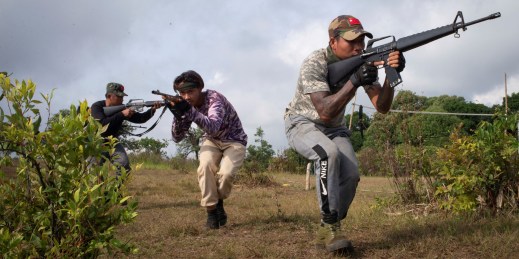 Three members of the Naypyidaw People’s Defense Force battalion take part in military training.
