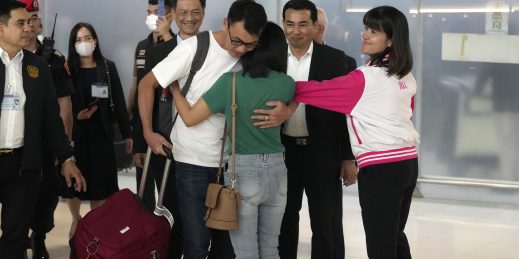 Owat Suriyasri, a Thai hostage who was freed from Hamas, hugs his wife.
