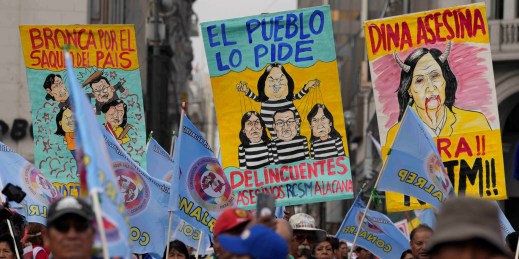 Protesters march in a demonstration against Peruvian President Dina Boluarte.