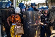 A protester confronts riot police in Mayotte.