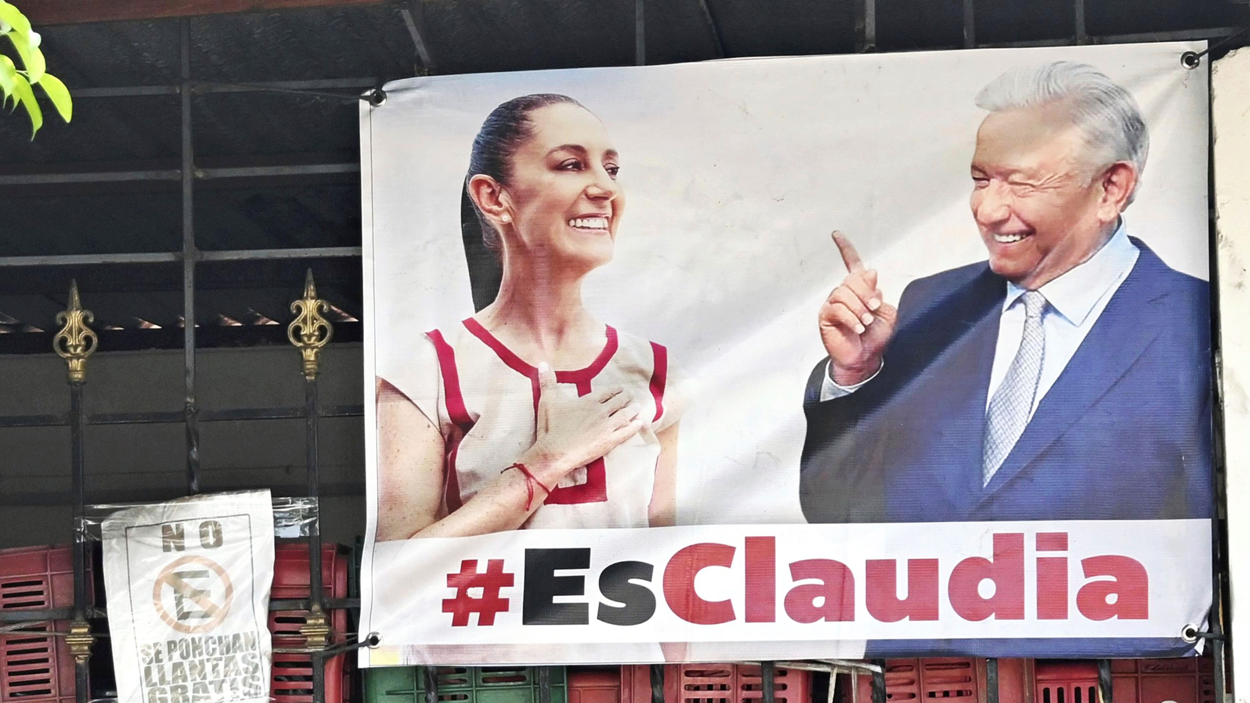 A banner showing Mexican presidential candidate Claudia Sheinbaum and President Andres Manuel Lopez Obrador.