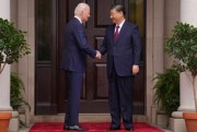U.S. President Joe Biden greets Chinese President Xi Jinping.